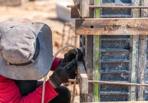 We used a water level to align the foundation posts. Stock Photos
