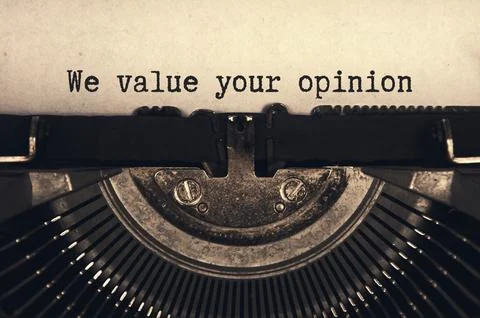 We value your opinion text typed on an old vintage typewriter in black and wh Foto stock
