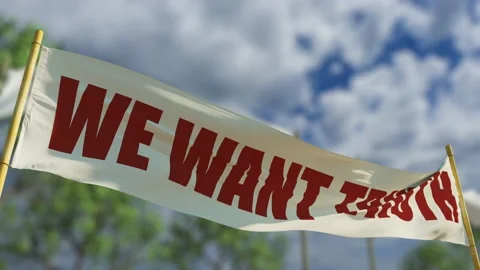 We want truth transparent flag on forest defocused backdrop Vidéo 200144574