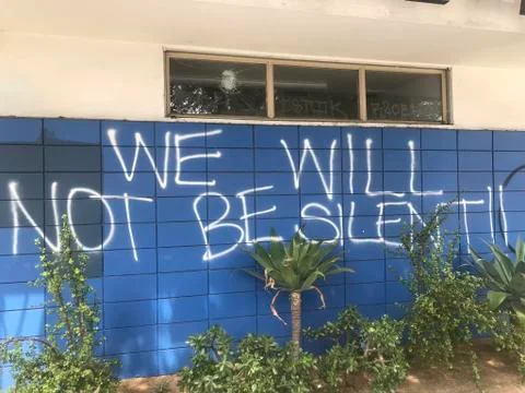 We will not be silent spray painted on the wall as part of black lives matter Stock Photos