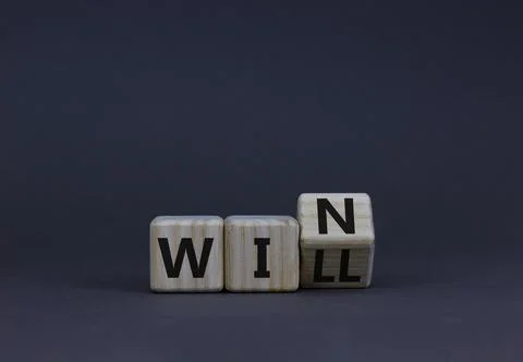 We will win symbol. Turned the wooden cubes and changed the concept word will 스톡 사진