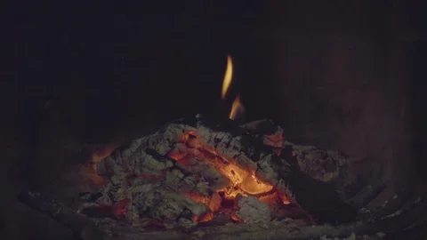 Weak fire and coals in fireplace - close-up Stock Footage 122689754