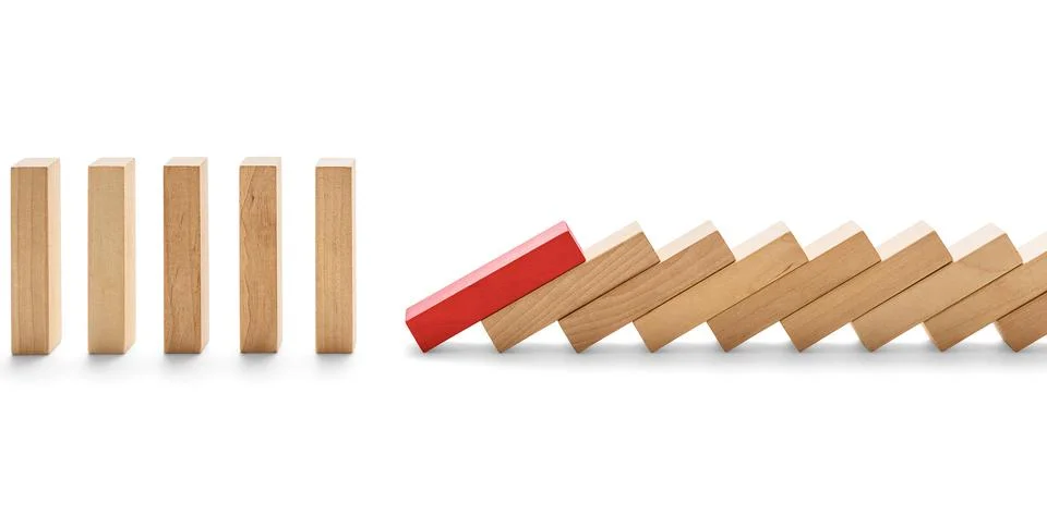 Weak link -Concept domino effect, the red wooden block knocked down the blo.. Stock Photos