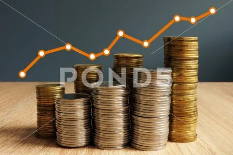 Wealth growth. Coins increase and financial chart. Business success. Stock Photos