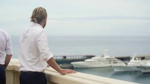 Wealthy billionaire looking at expensive yacht, luxury lifestyle of rich man Stock Footage