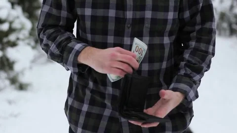 A wealthy guy counts money Stock Footage 84929422