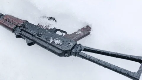 Weapon Abandoned On Snow Video stock 105353080