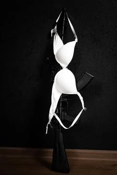 Weapon and bra Stock Photos