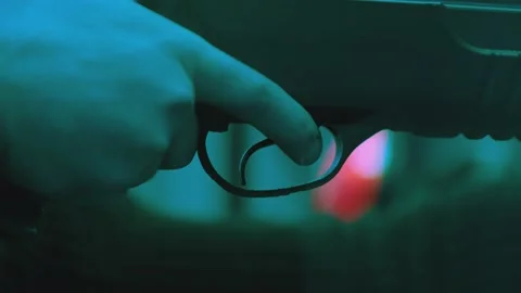 Weapon shot . Close-up finger pulls the trigger of rifle . Pulling the trigger 動画素材 197410288
