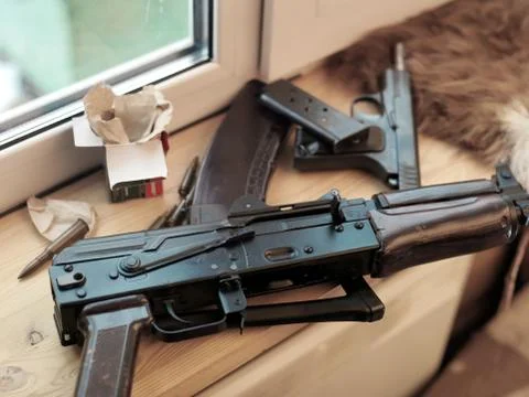 Weapon on window sill 库存照片