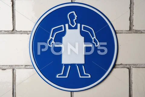 Wear apron' caution sign Stock Photos