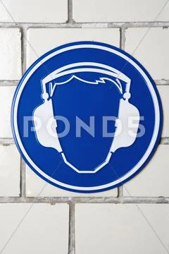 Wear ear protectors' caution sign Stock Photos