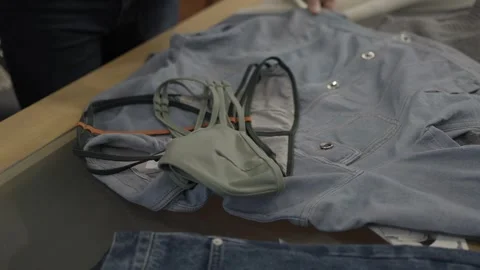 Wearable electronics wiring attached to jacket on table Video stock 327448728