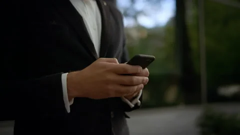 Wearing Classical Suit. Social Network. Apps. Smartphones. Close-up of male Stock-Footage 141255091