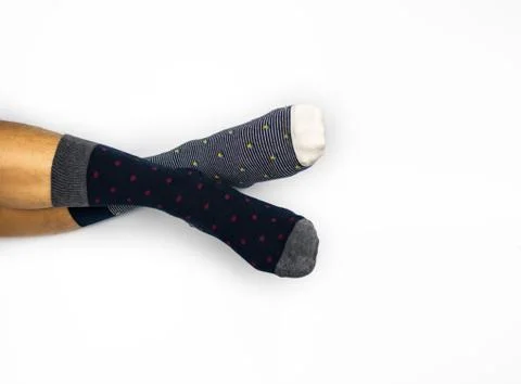 Wearing different pair of sock on white background Stock Photos