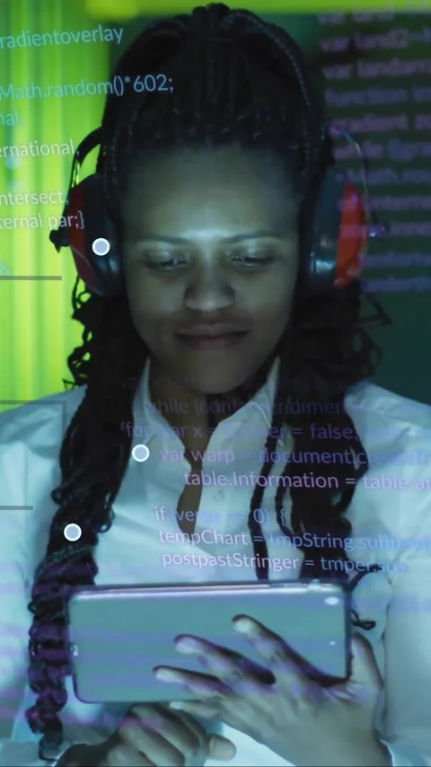 Wearing headphones and using tablet, woman with code and tech animation over Stock Footage 323780942