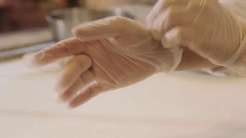 Wearing hygienic gloves Stock Footage 71723080