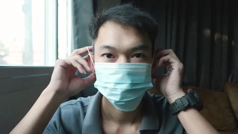 Wearing a mask Stock Footage 148322280