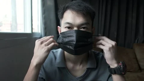 Wearing a mask Stock Footage 148322282