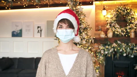 Wearing Protecting Mask during the Coronavirus Pandemic at Christmas Eve Stock Footage 144635704