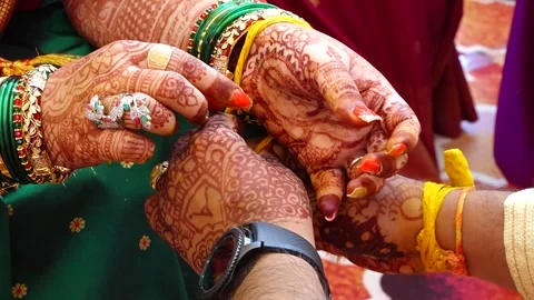 Wearing Turmeric Thread on hand of bride. Marathi Wedding Ceremony. Maharashtra  Stock Footage 246401878