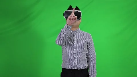 Wearing VR glasses to experience virtual reality science fiction scene green Stock Footage 165791137