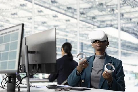Wearing VR headset, immersive circuit layouts and woman in microchip RD office Stock Photos