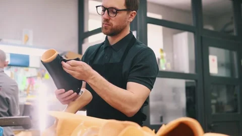 Wears black material. Technician working with prosthesis in modern laboratory. Stock Footage 243634134