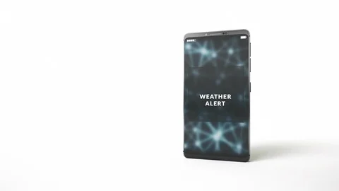 Weather alert message delivered, pop up notification on a phone display screen. Stock Footage
