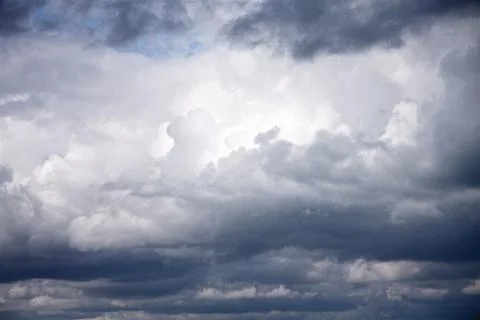 Weather background of storm clouds with hint of blue sky Stock Photos