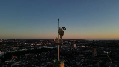 Weather vane during sunrise Stockbeeldmateriaal 207955601