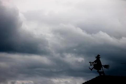 .weather vane in shape of a witch Stock Photos