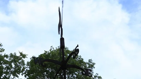 Weather Vane spins in the wind on a summer day Video stock 93396342