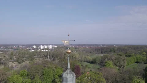 Weather Vane with Wolf Logo of 1878 with reveal of Wolfsburg castle, dolly Stock Footage 193474235