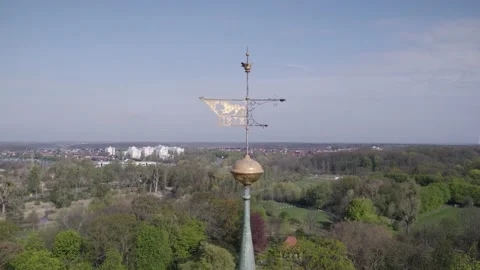 Weather Vane of Wolfsburg Castle with Wolf Logo, Aerial Dolly in Stock Footage 192415098