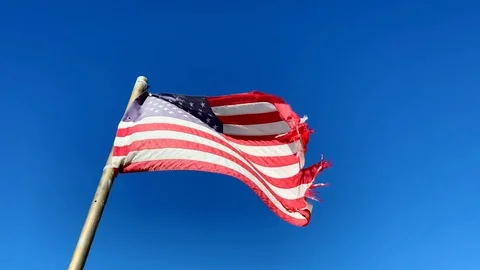 Weathered American Flag Blowing in the Wind Stock Footage