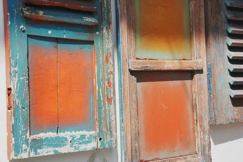 Weathered and old window rustic exterior, background texture. Stock Photos