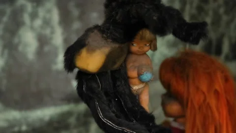 Weathered Baby Doll Held By Black Plush Animal At Island Dolls Xochimilco Stock Footage 345099152