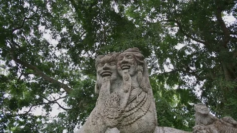 Weathered Balinese Stone Carving of Two-Headed Mythological Figure in Bali Stock Footage 345219902