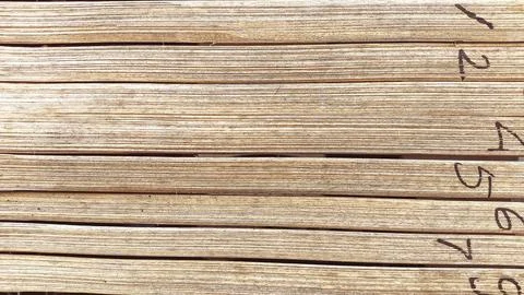 Weathered bamboo wall with horizontal texture and aged patina, ideal for de.. Stock Photos