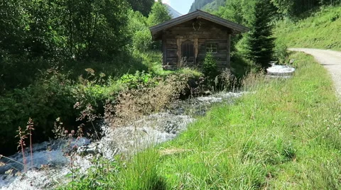 Weathered barn on a small stream in European alps. Schwarzachtal valley 스톡 동영상 67569883