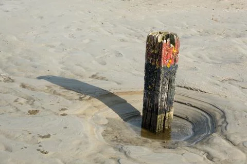 Weathered beach pole Stock Photos