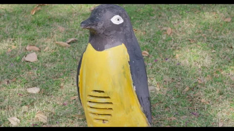 Weathered Bird-Shaped Garden Structure on Grass Stock Footage 330951956