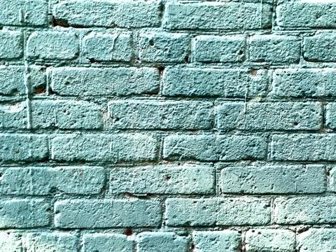 Weathered brick wall painted in muted teal tone Stock Photos