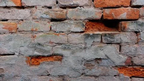Weathered Brick Wall Showing Texture and Colors in a Historical Setting Stock Photos