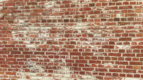 Weathered brick wall in an urban setting with unique textures and colors Stock Footage 305638408