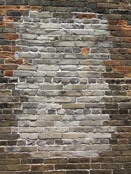 Weathered Brick Wall with White Patch Stock Photos