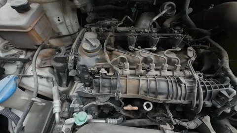 A weathered car engine, caked in dirt Stock Footage 280912098