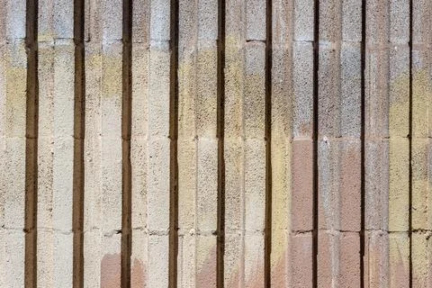 Weathered cement wall with vertical line pattern. City texture background Stock Photos