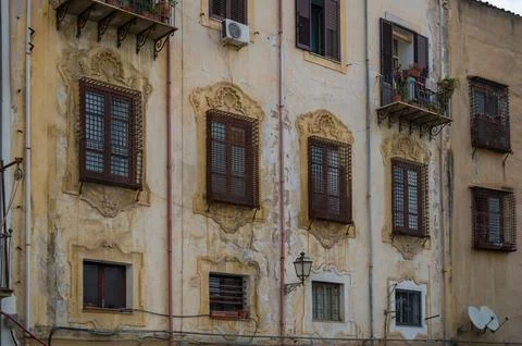 Weathered Charm of Historic Facade Photos